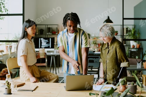 Preview: Three Diverse Managers Coworking In Office