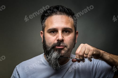 Preview: Expressive barber cutting beard