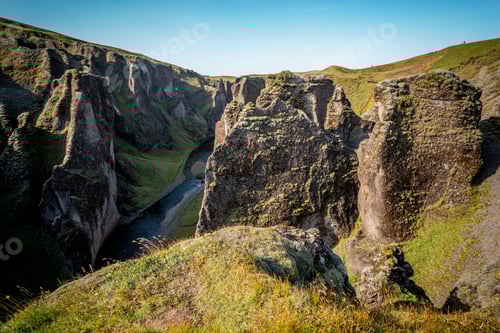 Preview: Canyon Fjaðrárgljúfur. Amazing Iceland's landscape with little river near the rocky waves