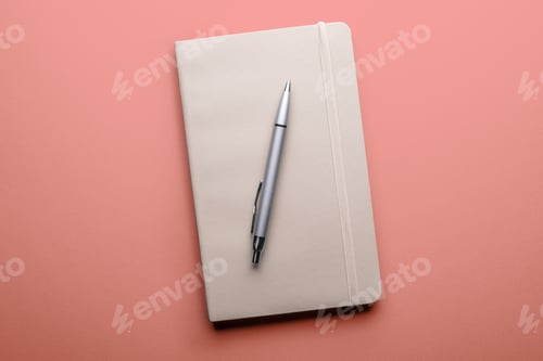 Preview: top view of old open book with fountain pen on pink background