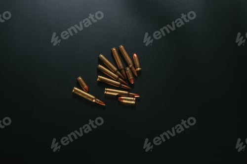 Preview: Top view of bullets on a black surface