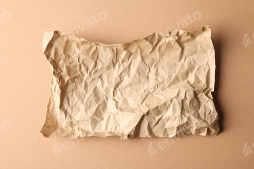 Preview: Crumpled paper on craft background, top view