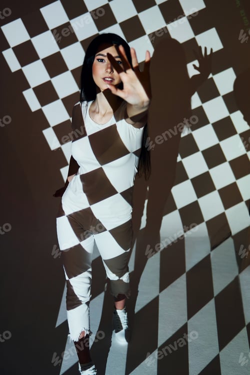 Preview: Square shaped lights. Beautiful young woman is in projector in the studio