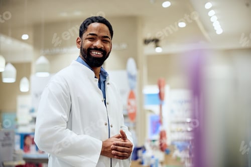 Preview: Confident Smiling Pharmacist at a Professional Pharmacy Workspace
