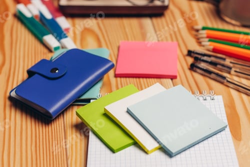 Preview: multicolored pencils stationery paper office wooden table