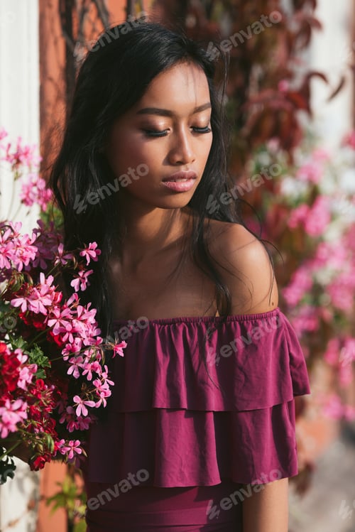 Preview: Young lady enjoying a moment in the sun ttractive, young woman