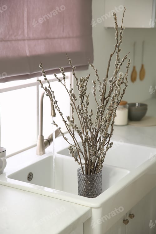 Preview: Beautiful blooming pussy willow branches in kitchen