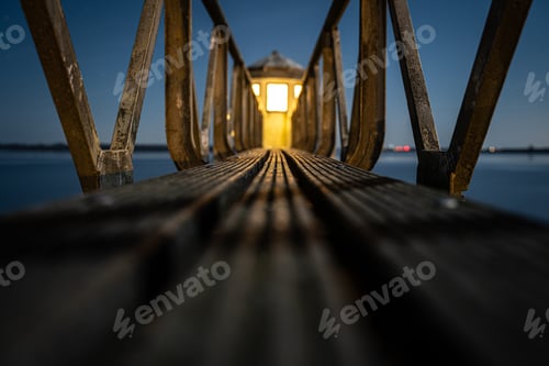 Preview: Beautiful lighthouse with wooden stairs at night