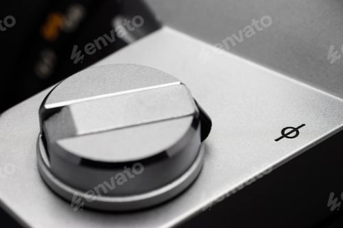 Preview: Focal plane mark next to a rewind crank on a retro film camera