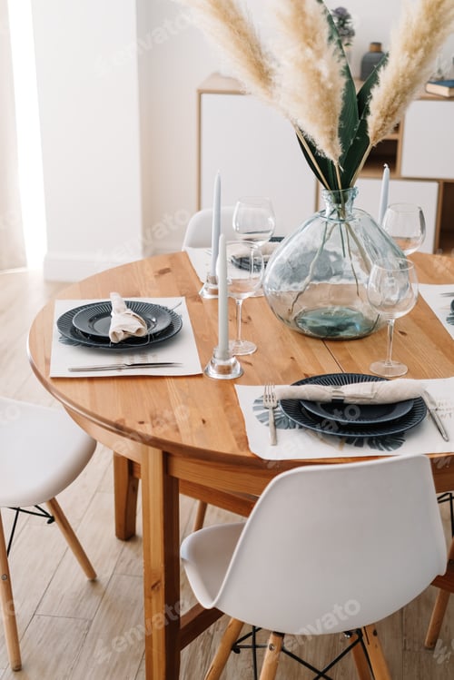 Preview: Served dining table in a modern Scandinavian kitchen.