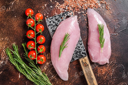 Preview: Butcher Raw Turkey steaks, Breasts fillet on a meat cleaver. Dark background. Top view