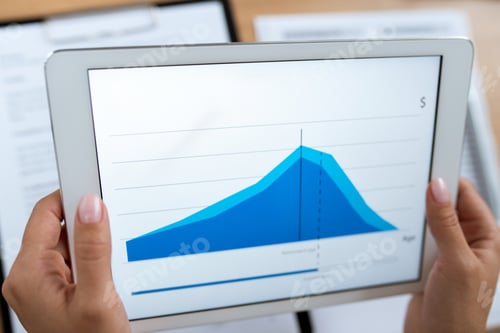 Preview: Real estate agent or financial advisor holding tablet with rate change graph