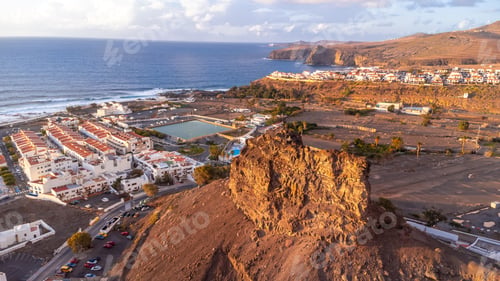 Preview: Aerial view of the town Agaete and its Puerto de las Nieves at summer sunset in Gran Canaria. Spain