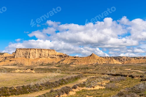 Preview: Bardenas reales desert showing eroded mountains and cloudy sky in navarre, spain