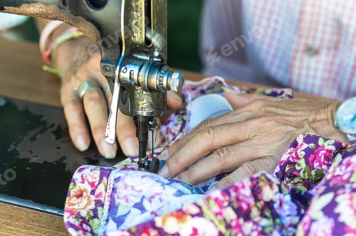 Preview: Sewing Process with old man designer hand