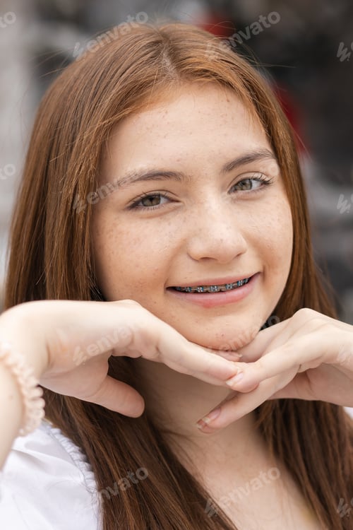 Preview: Portrait of face youaPortrait of face yong caucasian beautiful woman blond hair smiling with braces.