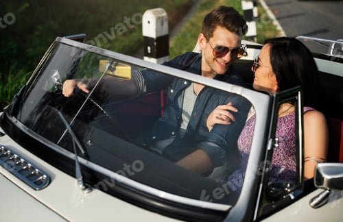 Preview: Couple Driving a Car Traveling on Road Trip Together