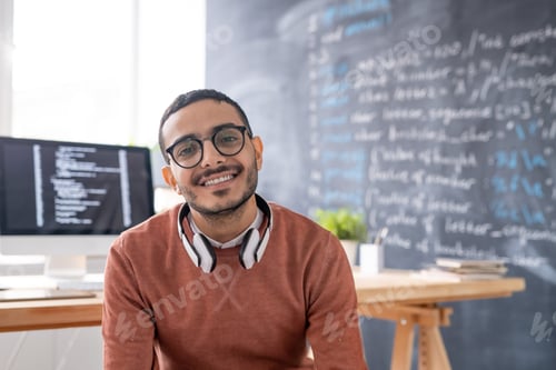 Preview: Smiling young Arabian programmer