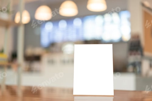 Preview: Menu frame with white blank screen on wooden table in restaurant or cafe on bokeh background