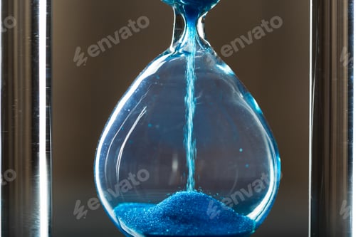 Preview: Time is passing. Blue hourglass close up
