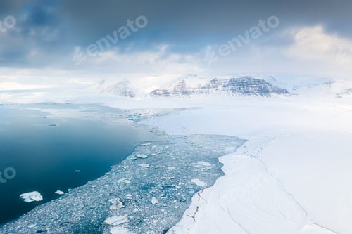 Preview: Iceland. An aerial view of an iceberg. Winter landscape from a drone. Jokulsarlon Iceberg Lagoon.