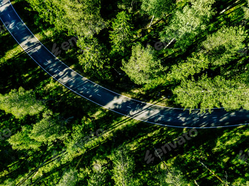 Preview: Aerial view of a road in green summer forest in Finland