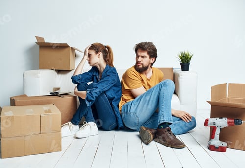 Preview: Portrait of man and woman with boxes moving plans for the future apartment