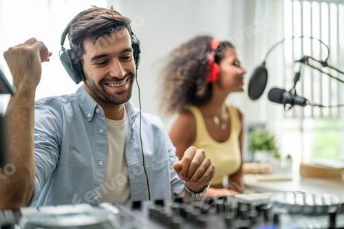 Preview: Diverse young stylish audio producer working in the music record studio.