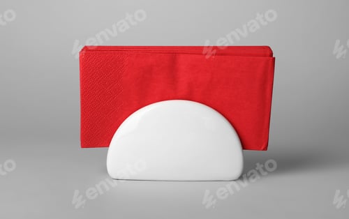 Preview: Ceramic napkin holder with paper serviettes on gray background