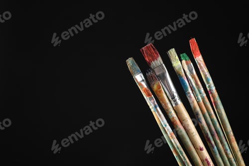 Preview: Many dirty paintbrushes on black background, closeup. Space for text
