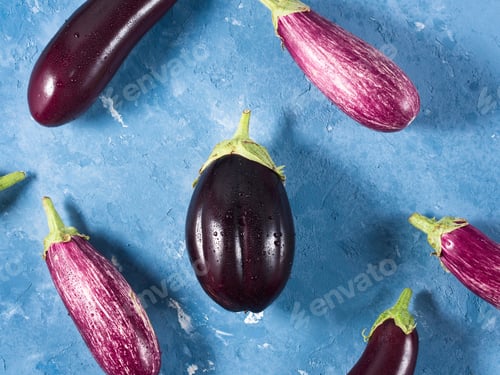 Preview: Eggplants on blue textured background