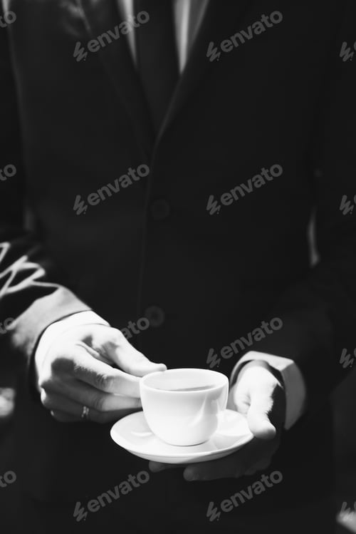 Preview: Businessman holding coffee cup