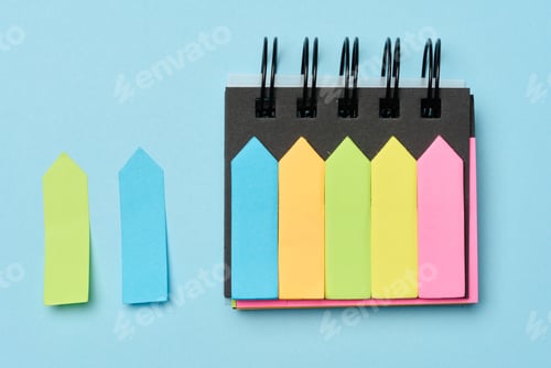 Preview: Multi-colored paper sticky notes on a blue background