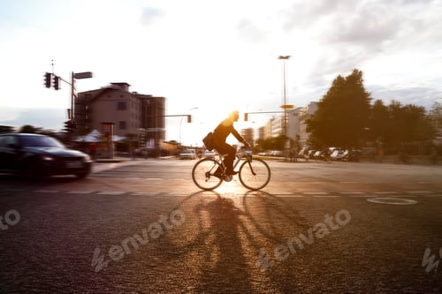 Preview: Germany, Berlin, Businessman cycling in the city