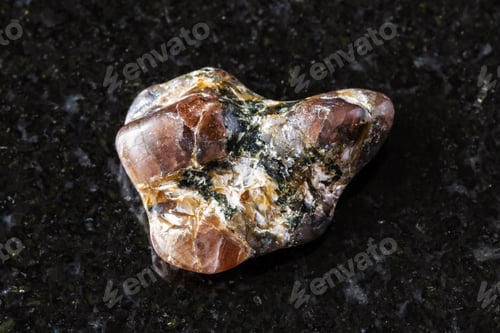Preview: sample of polished andalusite mineral on black