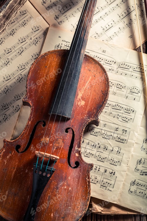 Preview: Old musical sheets and violin with ink and feather
