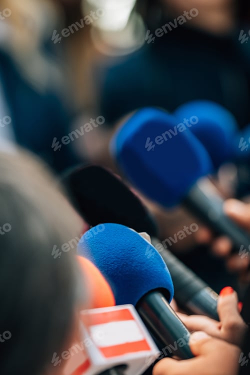 Preview: News reporters interviewing a politician.