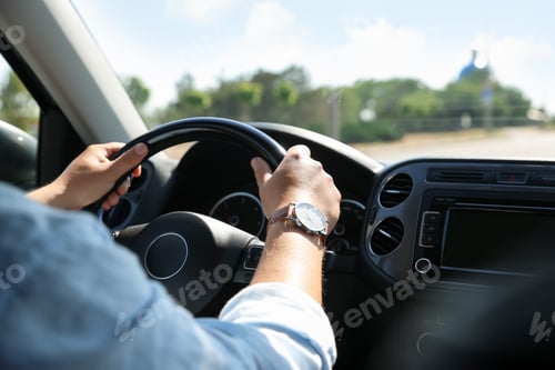 Preview: Man driving car with steering wheel, closeup