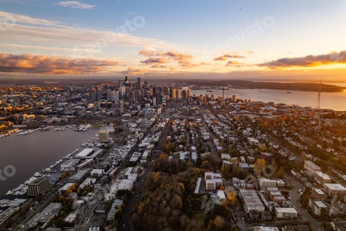 Preview: Seattle skyline at sunset with Space Needle and Elliott Bay.