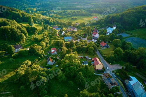 Preview: Aerial view of countryside area with village and mountains