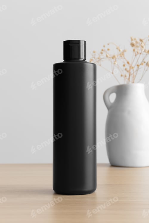 Preview: Black cosmetic lotion bottle mockup with a gypsophila on the wooden table.