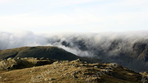 Preview: Beautiful mountainous landscape with billowing clouds