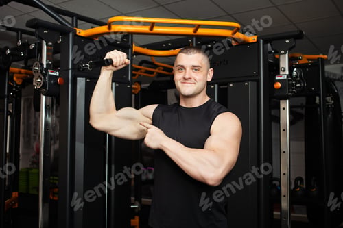 Preview: young handsome coach with a muscular body