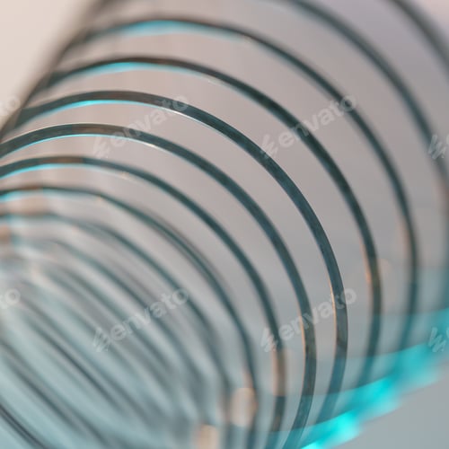 Preview: Closeup of coiled metal spring with sufficiently high strength and elastic properties in neon light