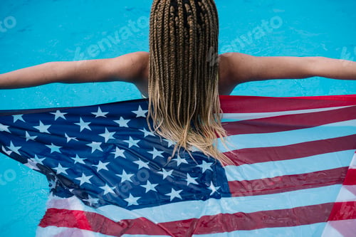 Preview: Woman inside the pool enjoying happy with American flag