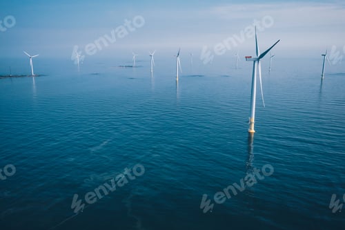 Preview: Wind turbine. Aerial view of wind turbines or windmills farm field in blue sea in Finland.