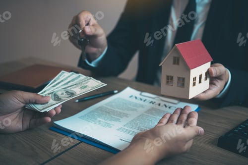 Preview: Businessman handed the house model and new homeowner giving money to real estate trading.