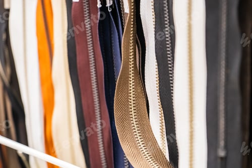 Preview: Set of multi-colored sewing zippers. Hobby goods in the store.