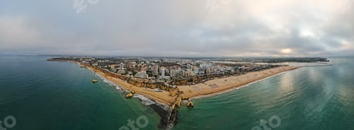 Preview: Aerial drone view of Portimao skyline and city beach of Praia da Rocha , Algarve,Portugal