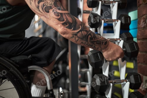 Preview: Focusing on Weightlifting in Gym While Using Wheelchair